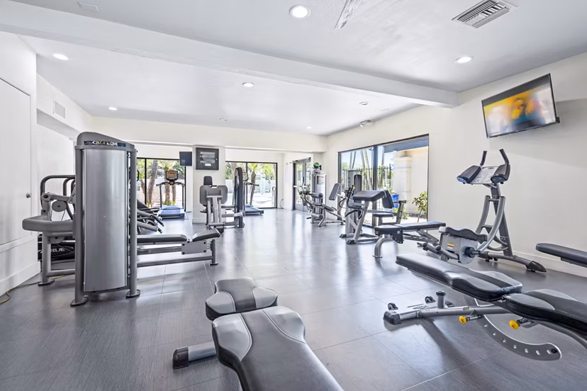 State-of-the-art fitness center at ENVii Apartments featuring modern gym equipment and spacious workout areas for residents