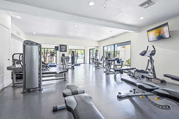 State-of-the-art fitness center at ENVii Apartments featuring modern gym equipment and spacious workout areas for residents
