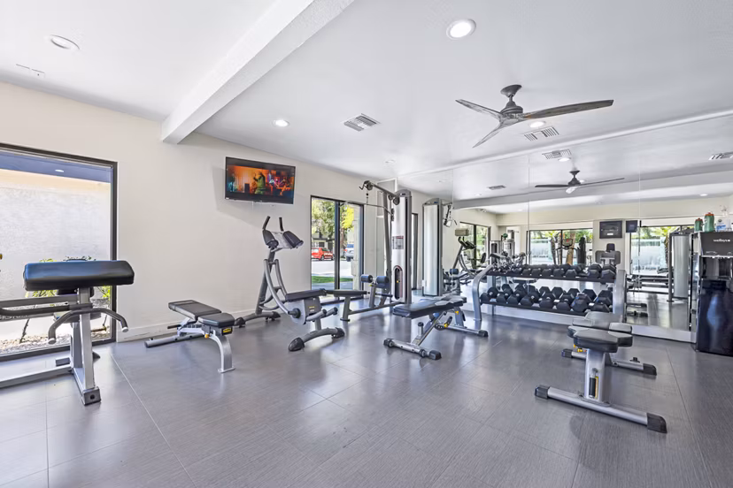 Modern fitness center with state-of-the-art equipment at ENVii Apartments, luxury living by Greystar