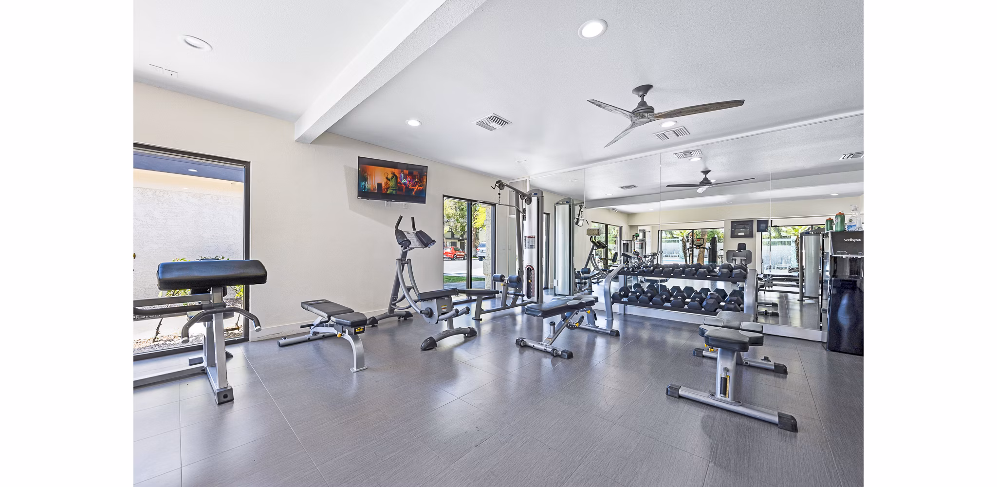Modern fitness center with state-of-the-art equipment at ENVii Apartments, luxury living by Greystar