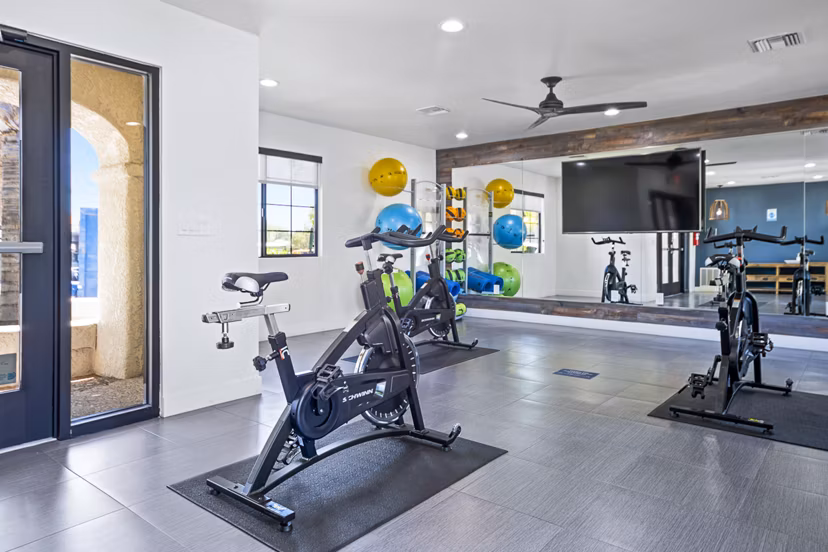 Yoga and spin studio with modern equipment at ENVii Apartments