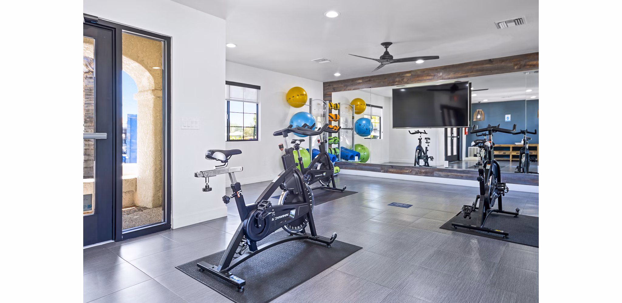 Yoga and spin studio with modern equipment at ENVii Apartments