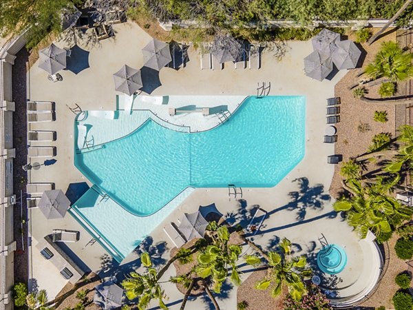 Luxurious outdoor pool at ENVii Apartments, offering a tranquil escape in a premium setting