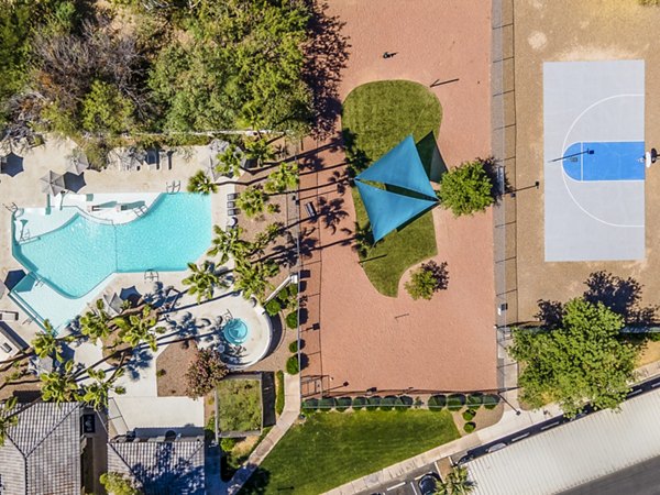 Modern outdoor pool at ENVii Apartments offering luxury relaxation amenities in vibrant city setting