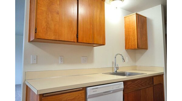 Modern kitchen featuring stainless steel appliances and granite countertops at Lancaster Terrace Apartments