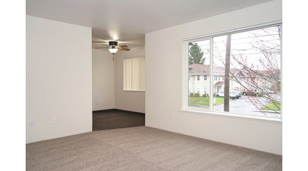 Modern living room with elegant decor and natural light at Lancaster Terrace Apartments