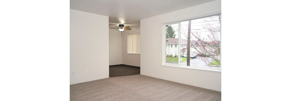 Modern living room with elegant decor and natural light at Lancaster Terrace Apartments