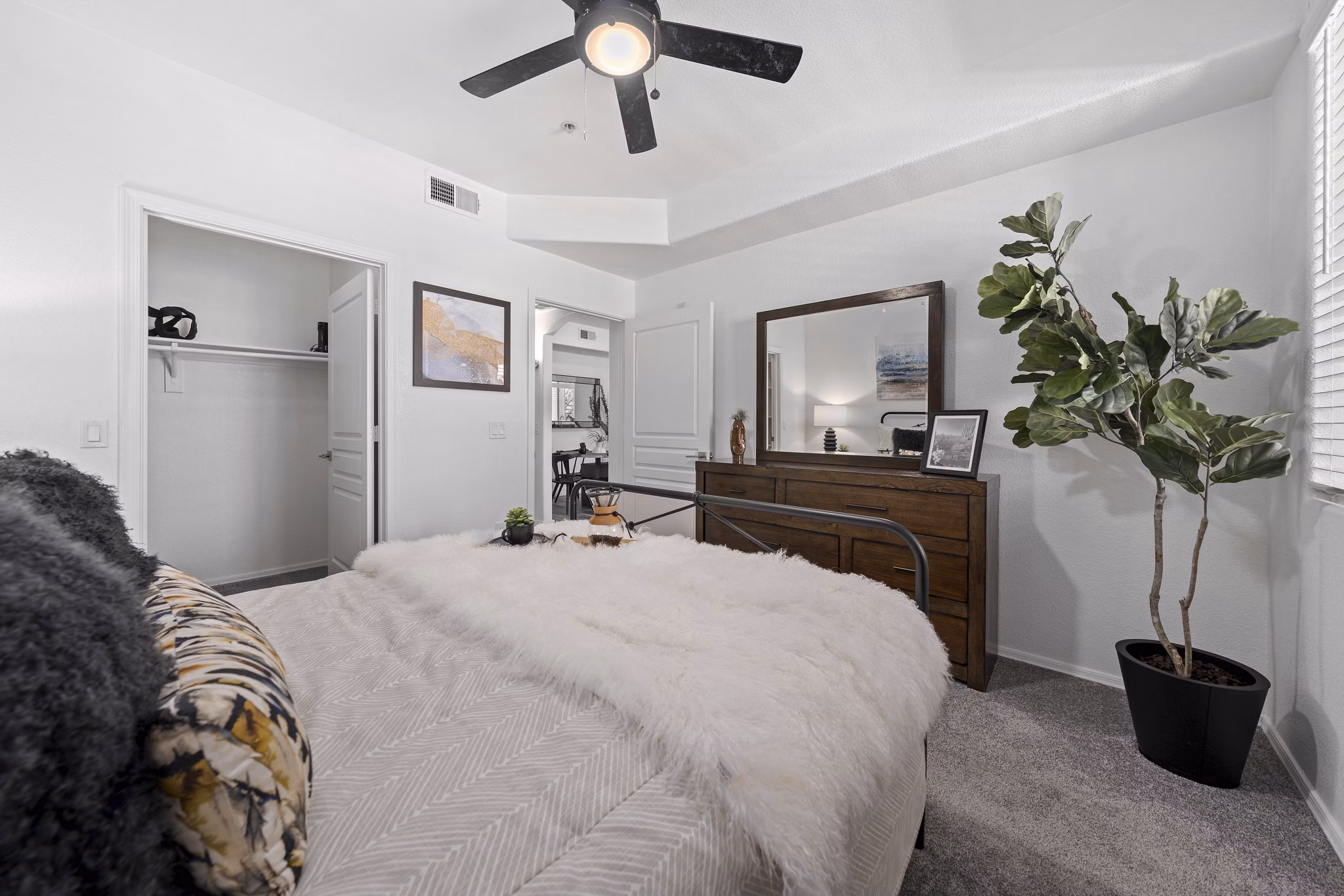 Elegant bedroom featuring modern decor and ample natural light at Tempe Station Apartments in Greystar's luxury residential portfolio