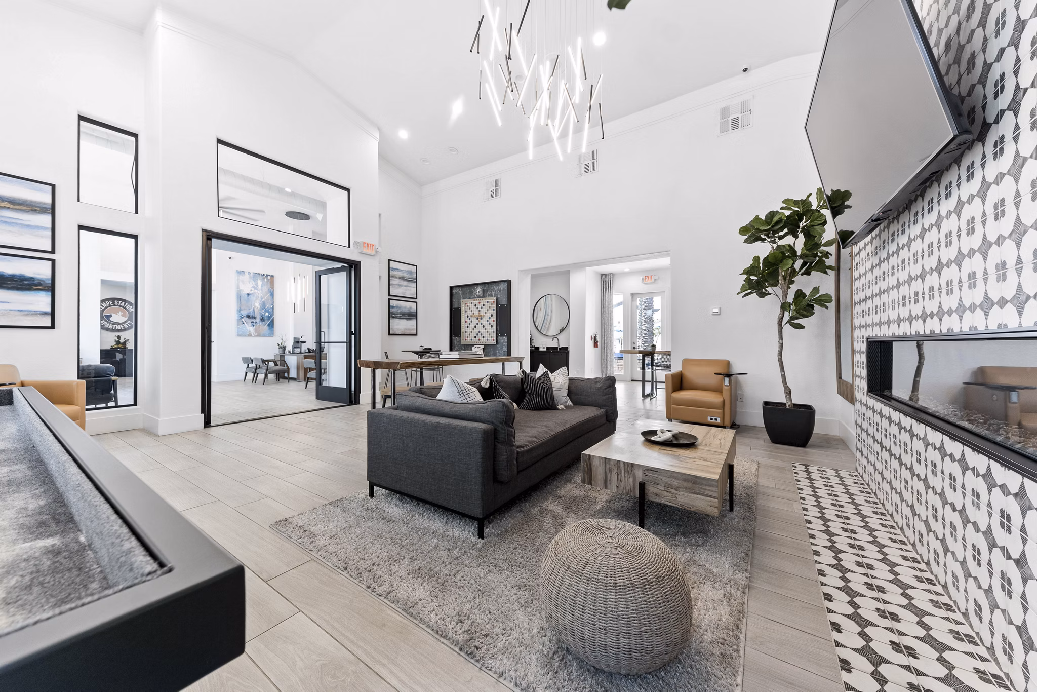 Clubhouse with modern furnishings and entertainment spaces at Tempe Station Apartments, a luxury community
