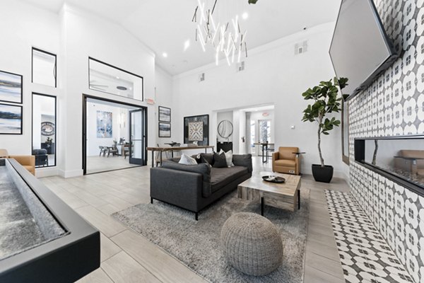 Clubhouse with modern furnishings and entertainment spaces at Tempe Station Apartments, a luxury community