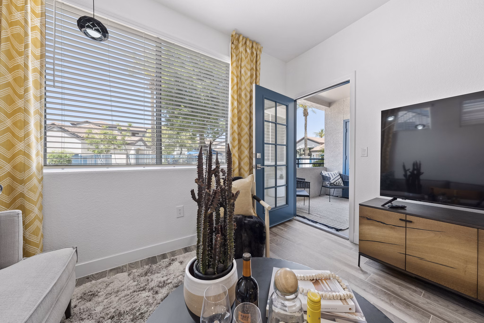 Modern living room with sleek furnishings and natural light at Tempe Station Apartments