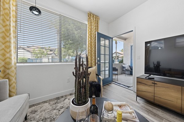 Modern living room with sleek furnishings and natural light at Tempe Station Apartments