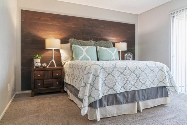 Chic bedroom with modern decor at Westmount at Urban Trails Apartments
