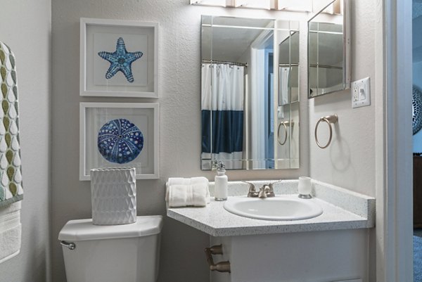 Bathroom with modern fixtures and marble countertops in Westmount at Urban Trails Apartments