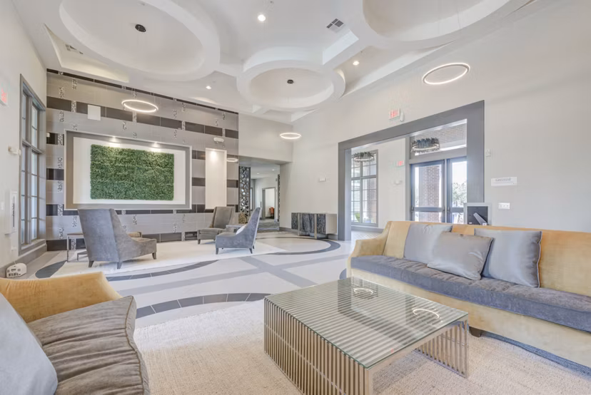 Clubhouse with modern design and seating areas at Lone Oak Apartments for social gatherings and events