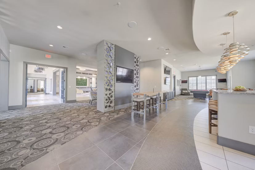 Clubhouse featuring modern lounge and entertainment areas at Lone Oak Apartments