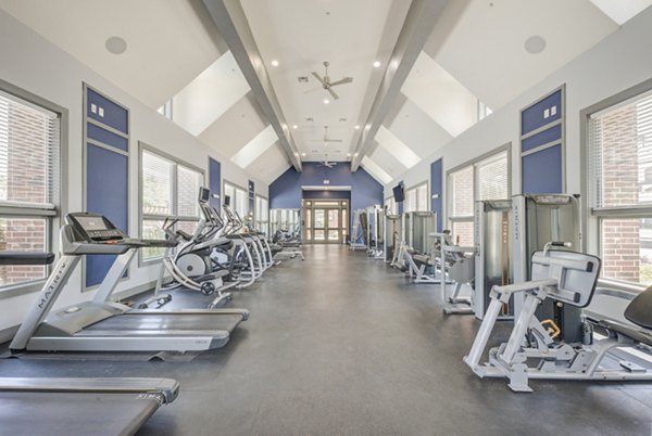 Fitness center equipped with modern gym equipment at Lone Oak Apartments
