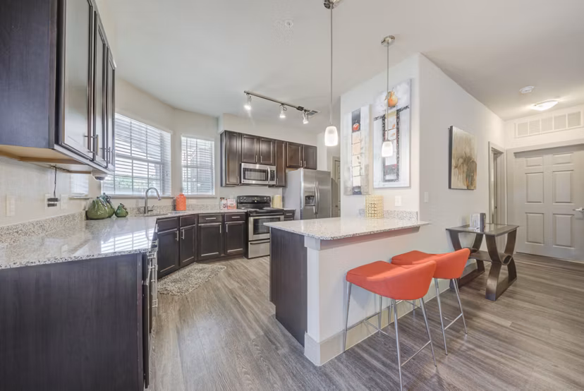 Modern kitchen with sleek cabinetry and stainless appliances at Aventura Bellevue Apartments