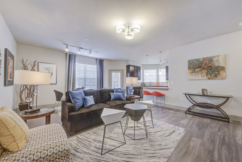 Spacious living room with modern decor at Lone Oak Apartments, featuring comfortable seating and ample natural light