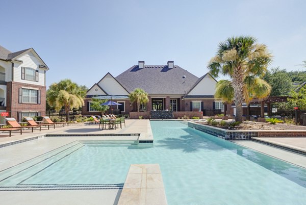 Elegant outdoor pool area at Lone Oak Apartments offering luxurious leisure experience