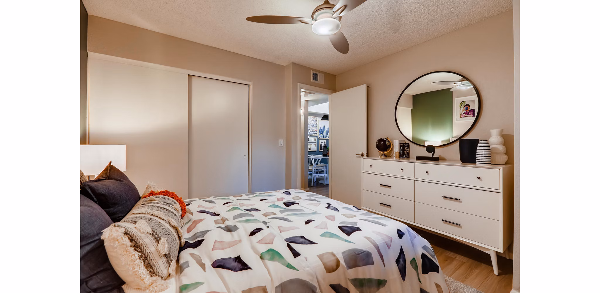Cozy bedroom with modern decor at Espiral Apartments in luxury Greystar community