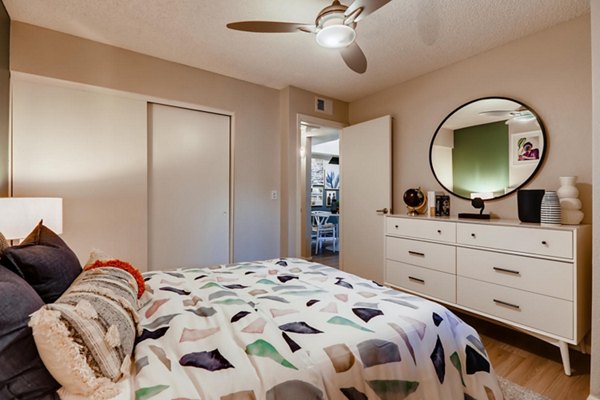 Cozy bedroom with modern decor at Espiral Apartments in luxury Greystar community