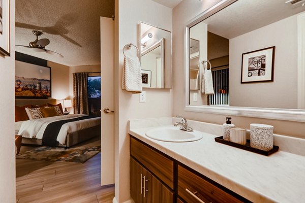 Bathroom featuring modern fixtures and marble countertops at Espiral Apartments, luxury living by Greystar