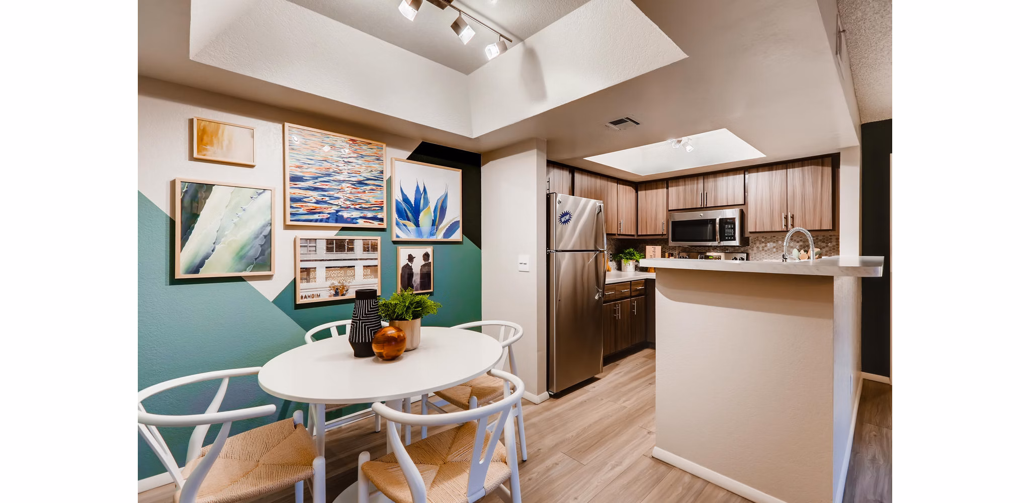Elegant dining room with modern decor at Espiral Apartments, luxury living by Greystar