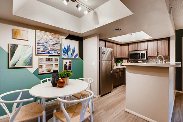 Elegant dining room with modern decor at Espiral Apartments, luxury living by Greystar