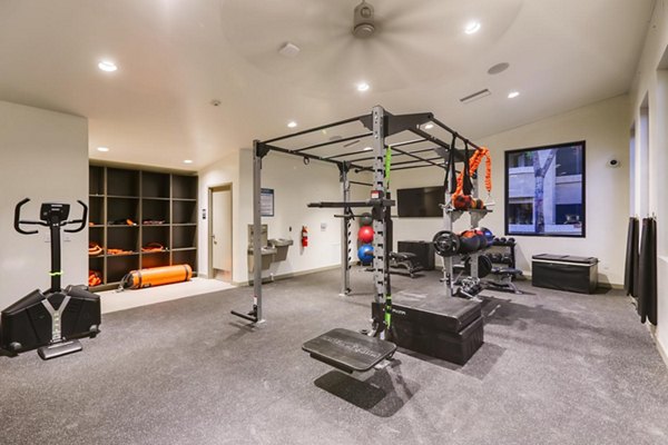 Modern fitness center with state-of-the-art equipment at Espiral Apartments