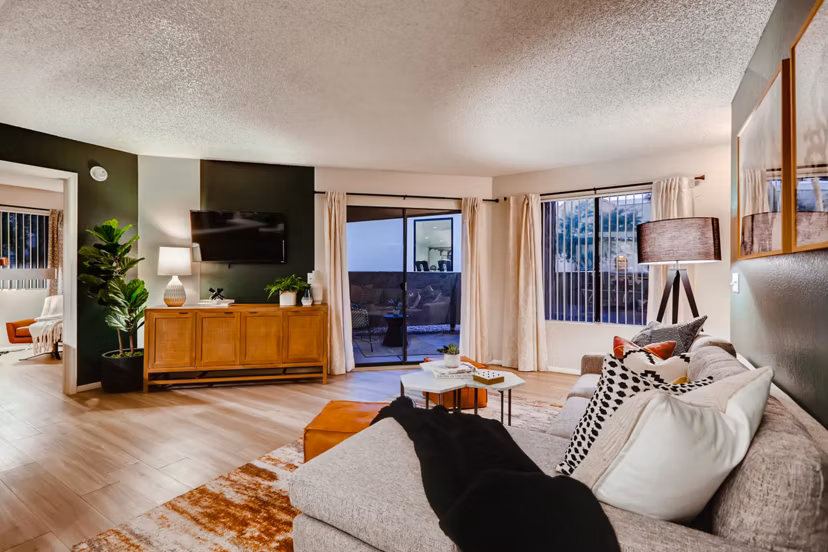 Modern living room with chic decor and large windows in Espiral Apartments
