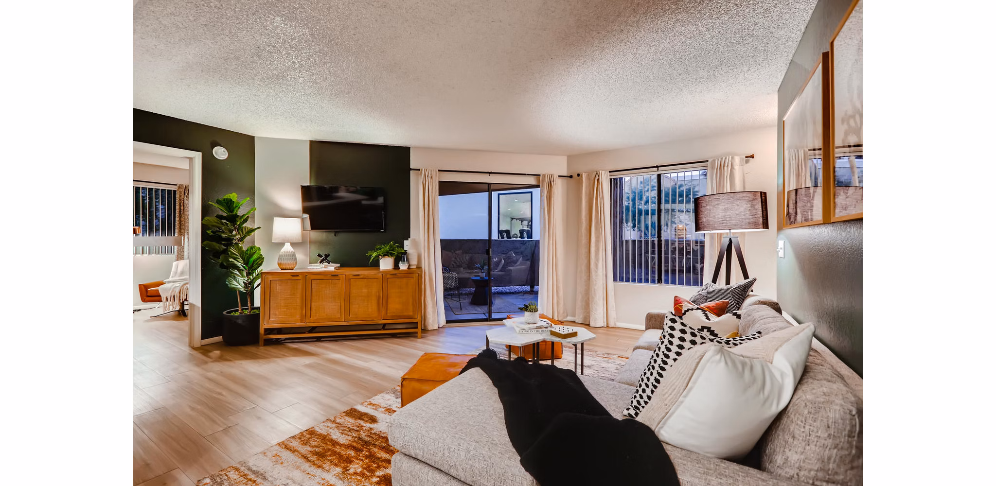 Modern living room with chic decor and large windows in Espiral Apartments