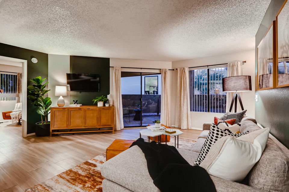 Modern living room with chic decor and large windows in Espiral Apartments