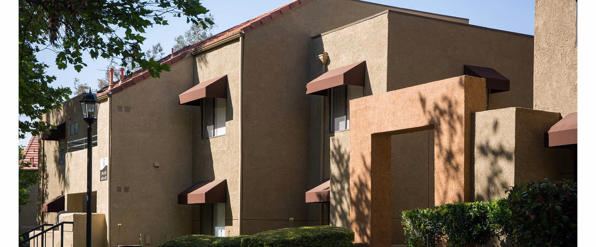 The Highlands at Grand Terrace: Elegant building facade of luxury apartments