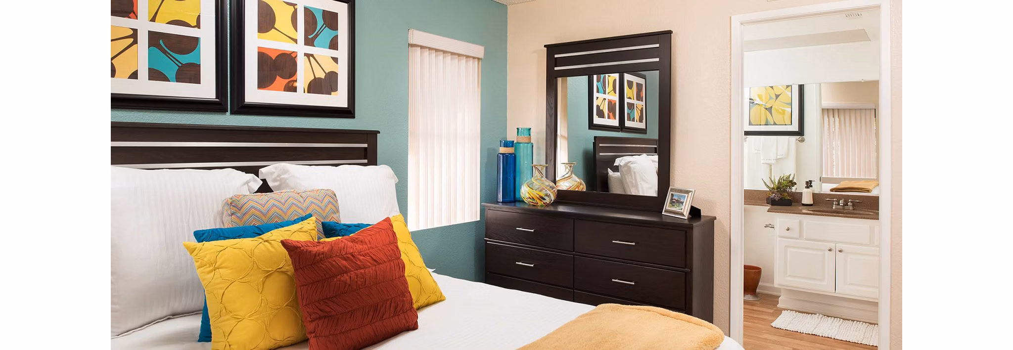 Cozy bedroom with modern decor at The Highlands at Grand Terrace Apartments