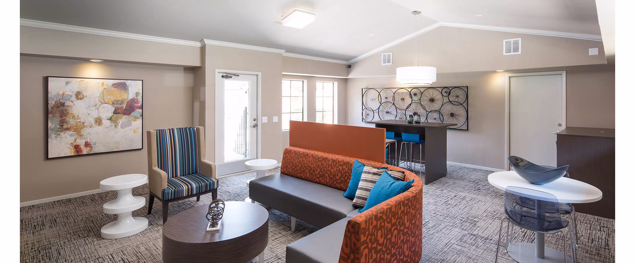 The Highlands at Grand Terrace: Modern clubhouse with elegant decor and seating areas for community gatherings at luxury apartments