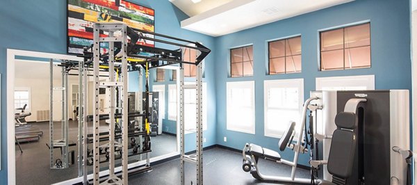 State-of-the-art fitness center at The Highlands at Grand Terrace Apartments, featuring modern exercise equipment for residents