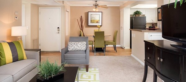 Spacious living room with modern furnishings at The Highlands at Grand Terrace Apartments