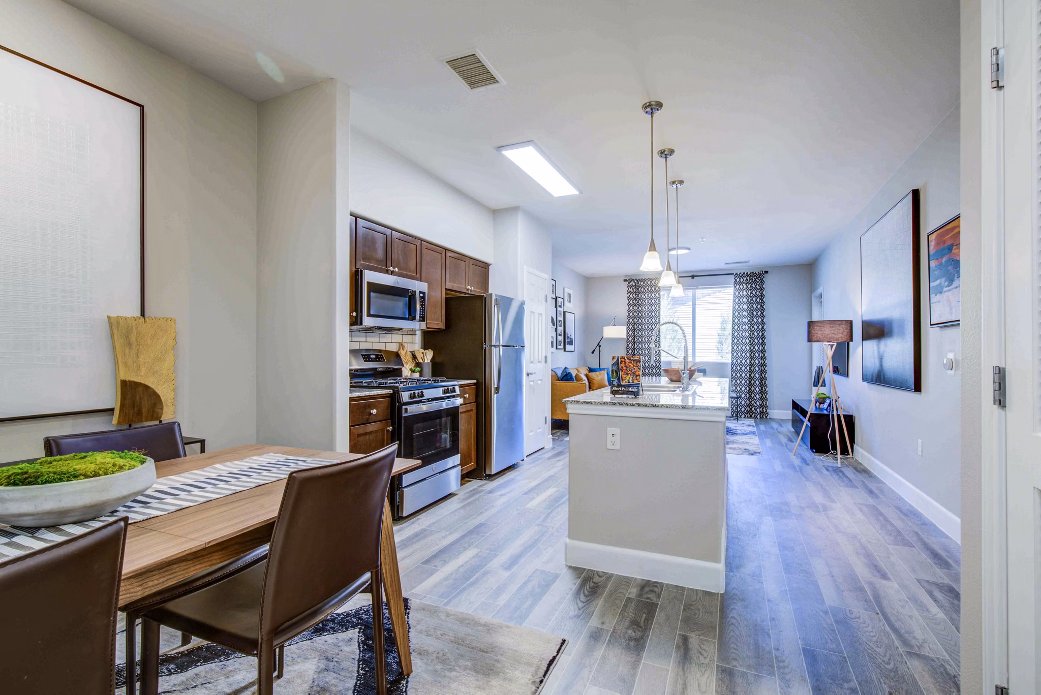 Elegant dining room with stylish lighting and contemporary decor at Rockrimmon Apartments, Greystar luxury apartments