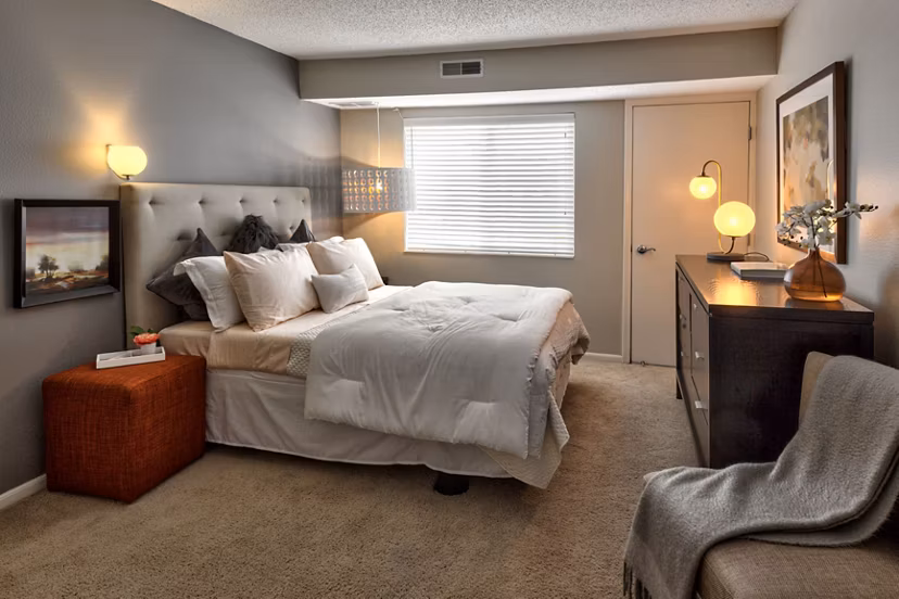 Cozy bedroom with modern decor at Avana Addison Apartments luxury living