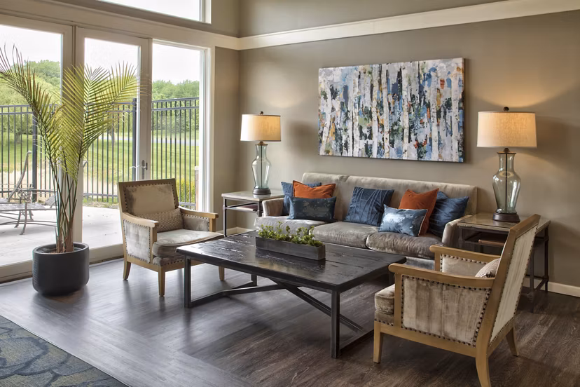 Clubhouse featuring modern design and lounging areas at Avana Addison Apartments