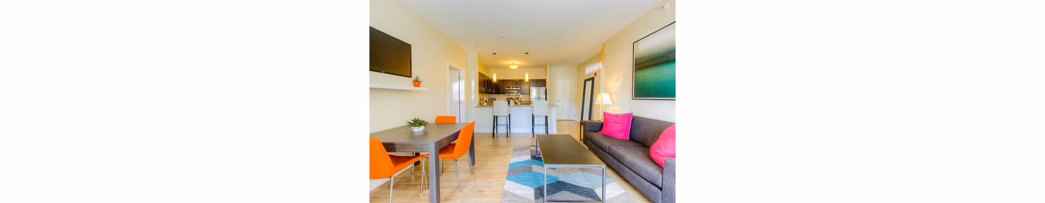 Spacious living room with modern design elements in Avana Addison Apartments