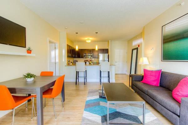 Spacious living room with modern design elements in Avana Addison Apartments