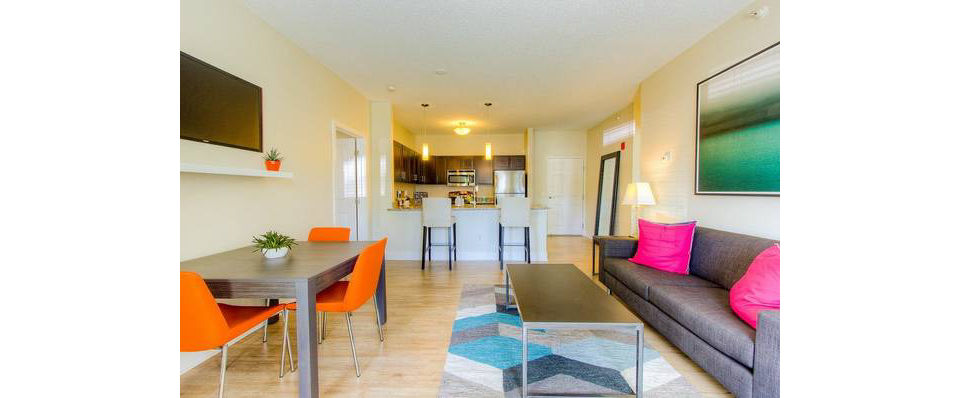 Spacious living room with modern design elements in Avana Addison Apartments