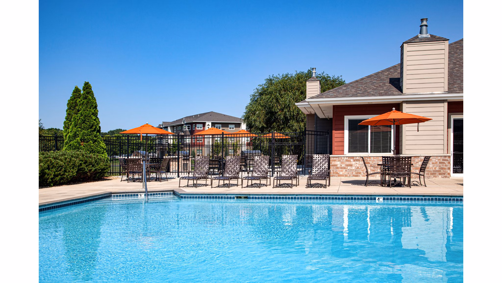 Resort-style pool with loungers at Avana Addison Apartments