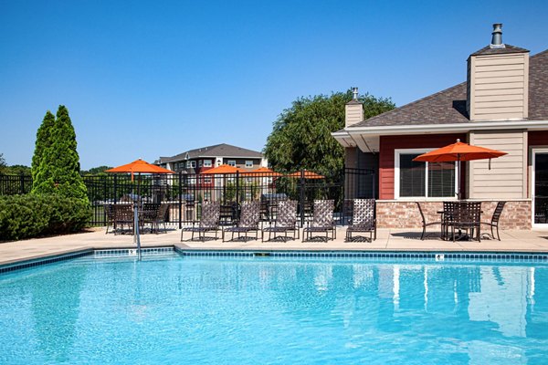 Resort-style pool with loungers at Avana Addison Apartments