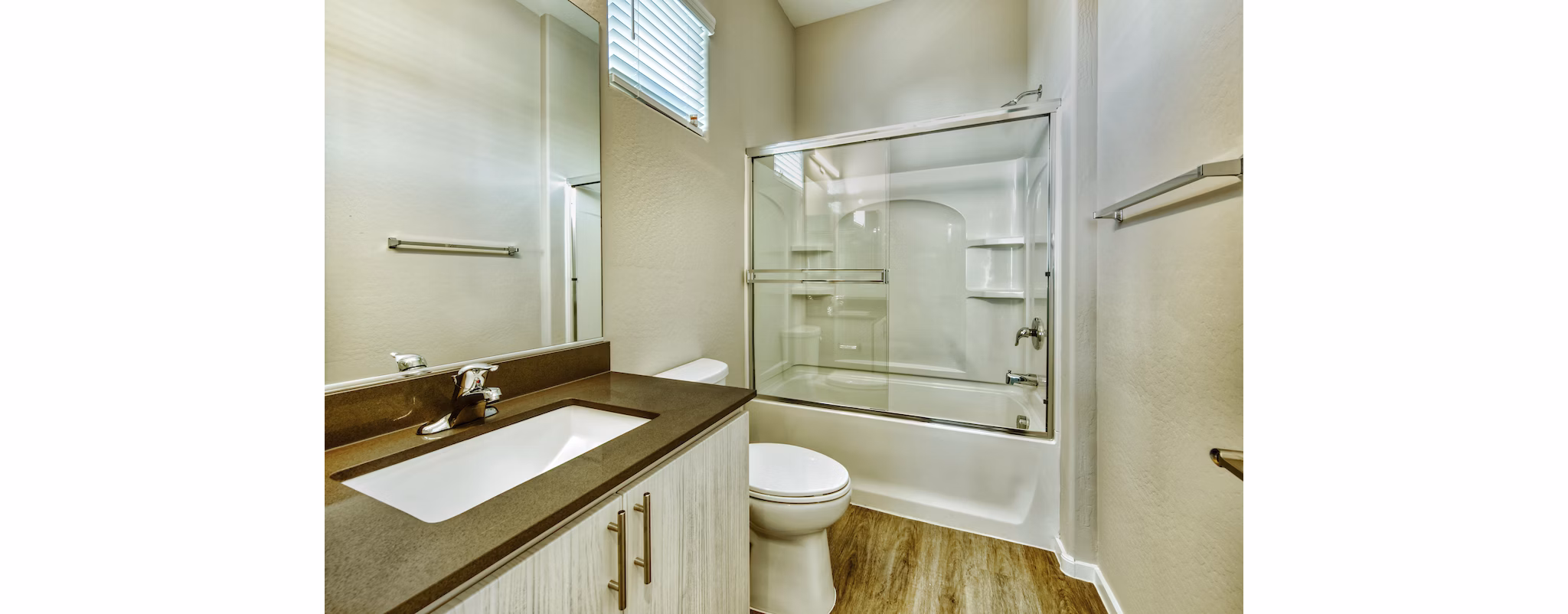 Modern bathroom with sleek fixtures and ample lighting at Abode at Litchfield Park Apartments