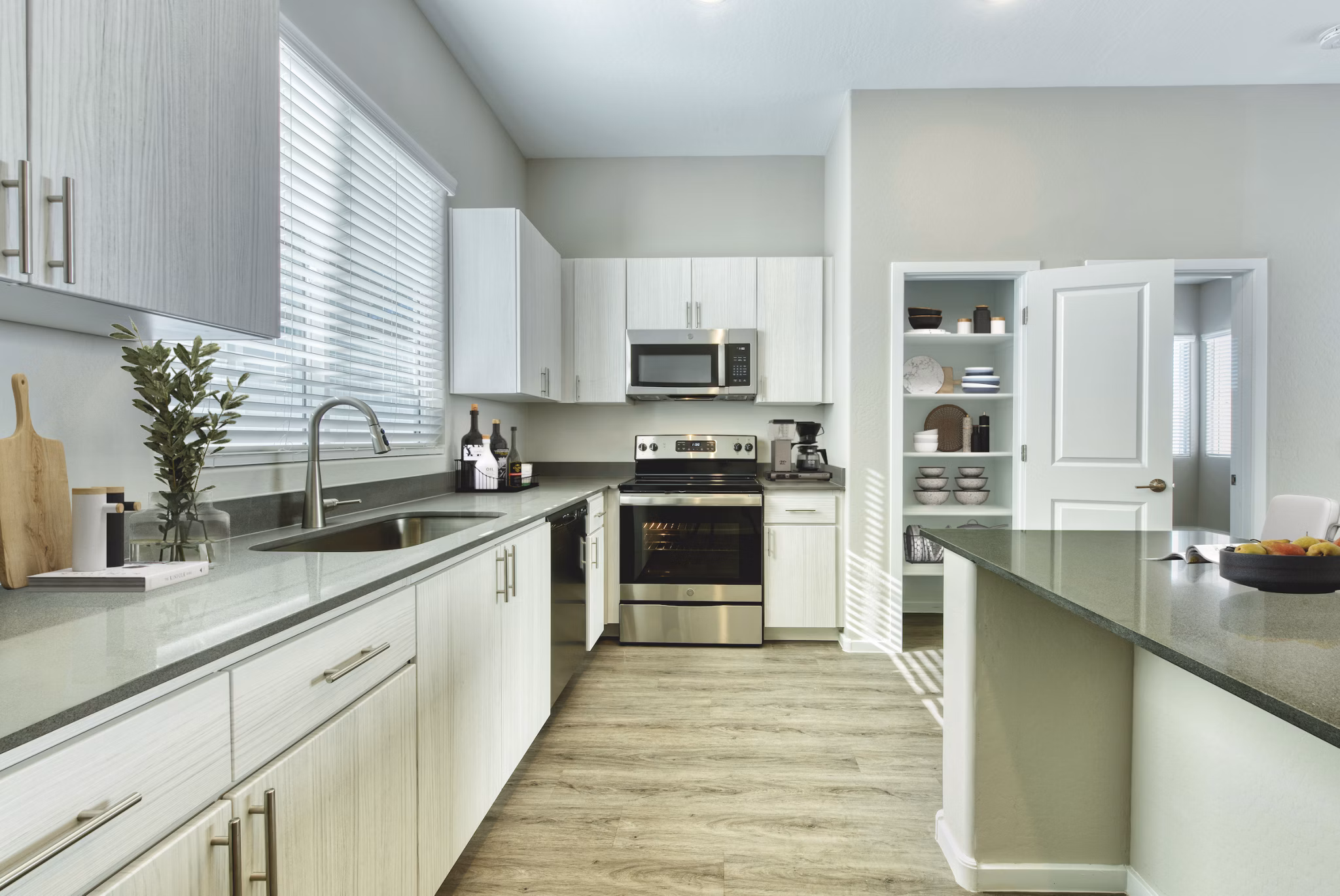 Modern kitchen with stainless steel appliances at Abode at Litchfield Park Apartments