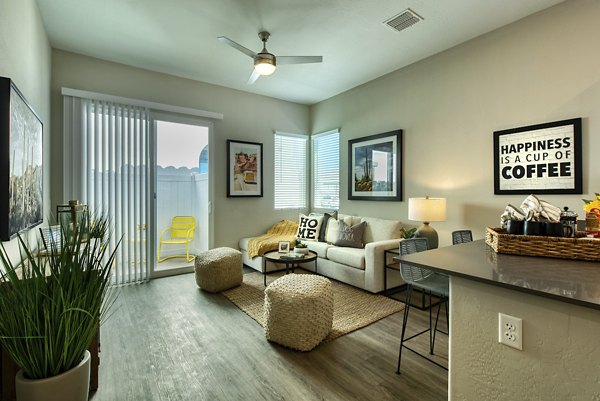 Spacious living room with modern decor at Abode at Litchfield Park Apartments