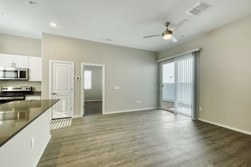 Modern living room with elegant furnishings at Abode at Litchfield Park Apartments, featuring sleek design and cozy ambiance
